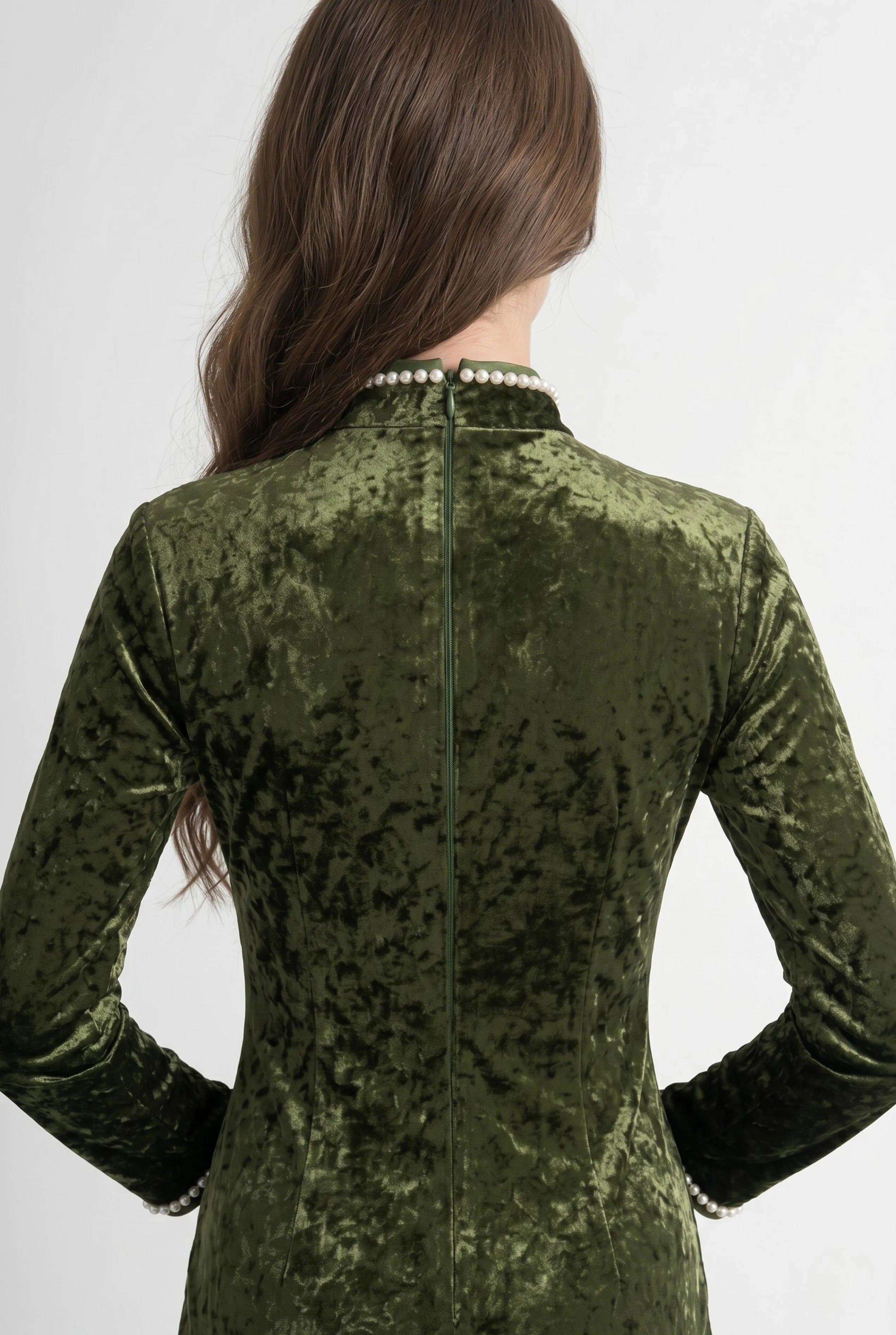 Close-up back view showing the hidden zipper and high collar structure of the long sleeve olive velvet cheongsam