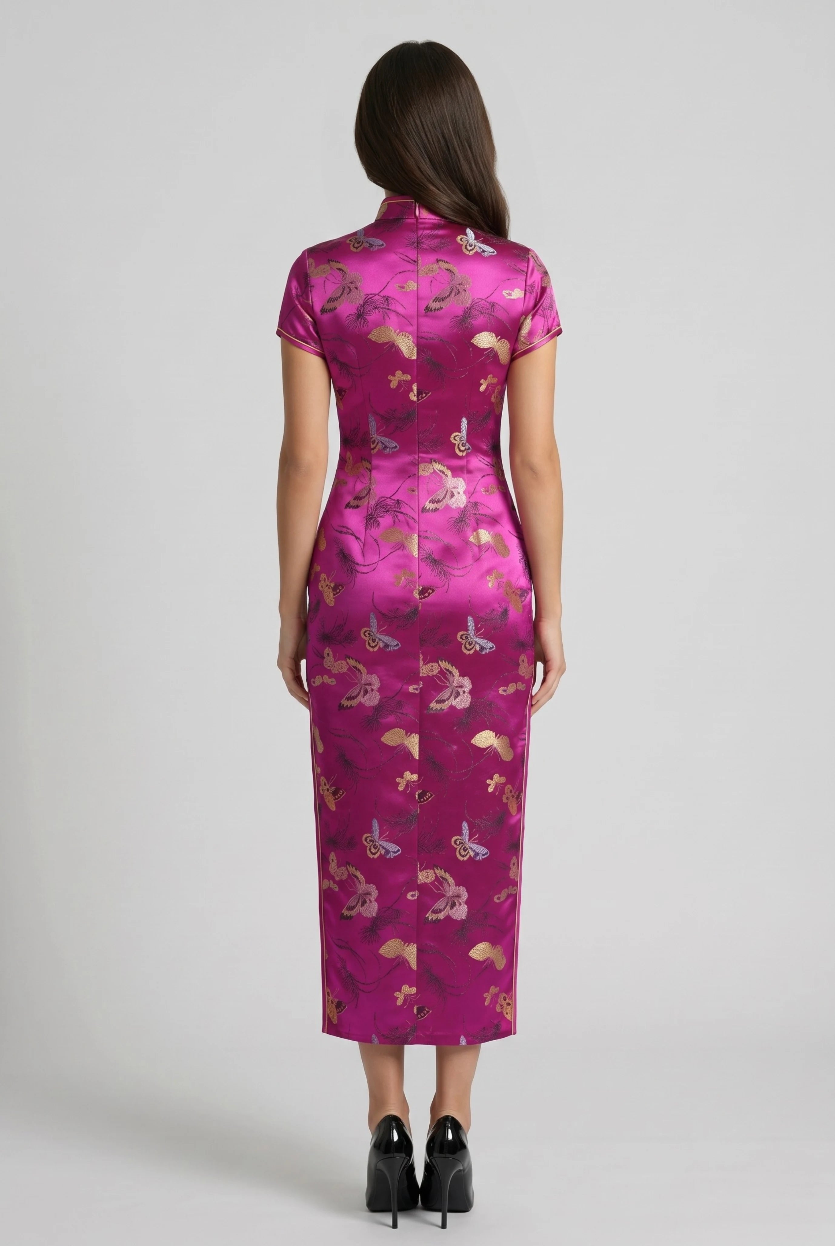Full-length back view of the pink traditional Chinese dress showing its sleek form-fitting midi silhouette