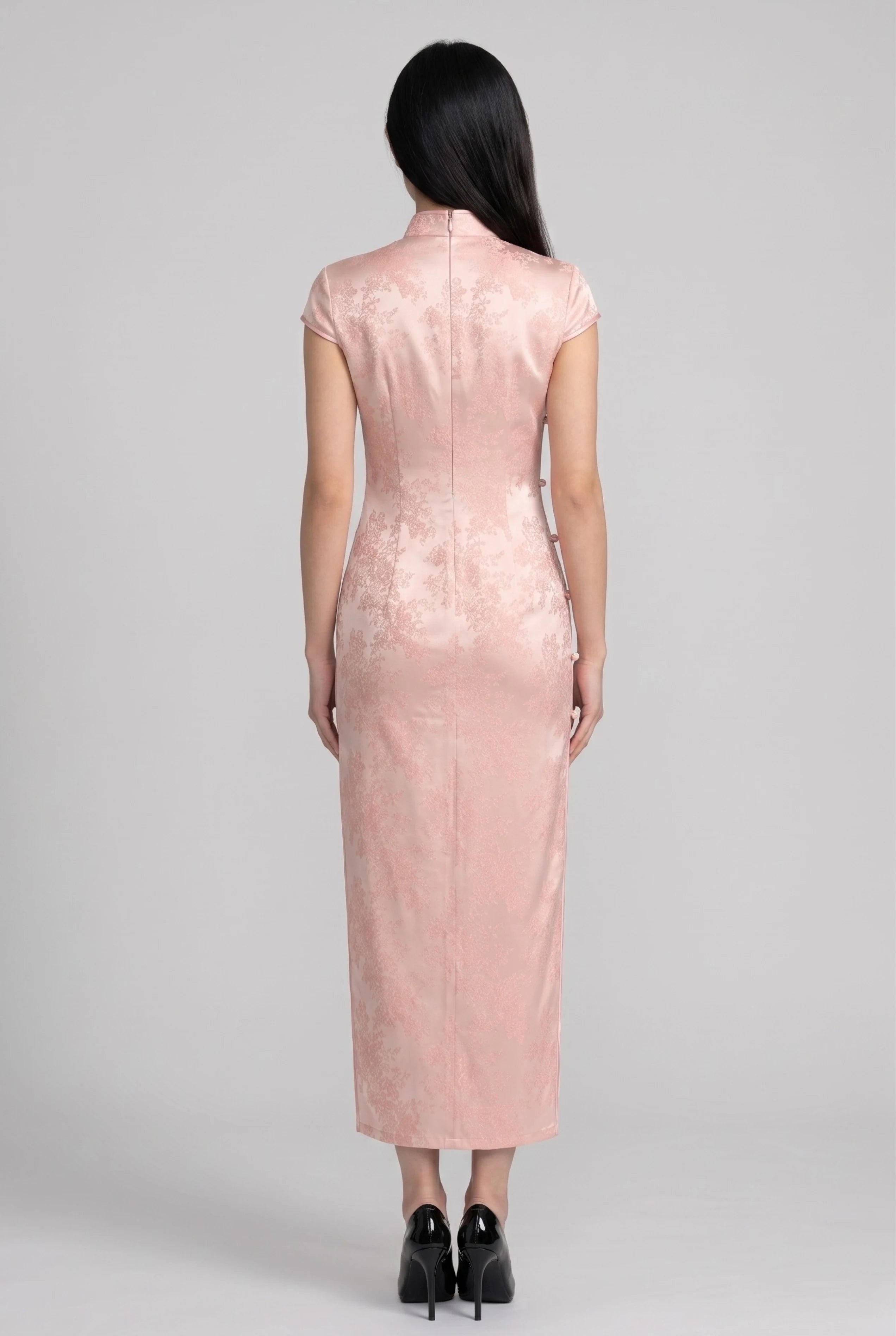 Full-length back view of the pink satin Chinese style dress showing the form-fitting ankle-length cut