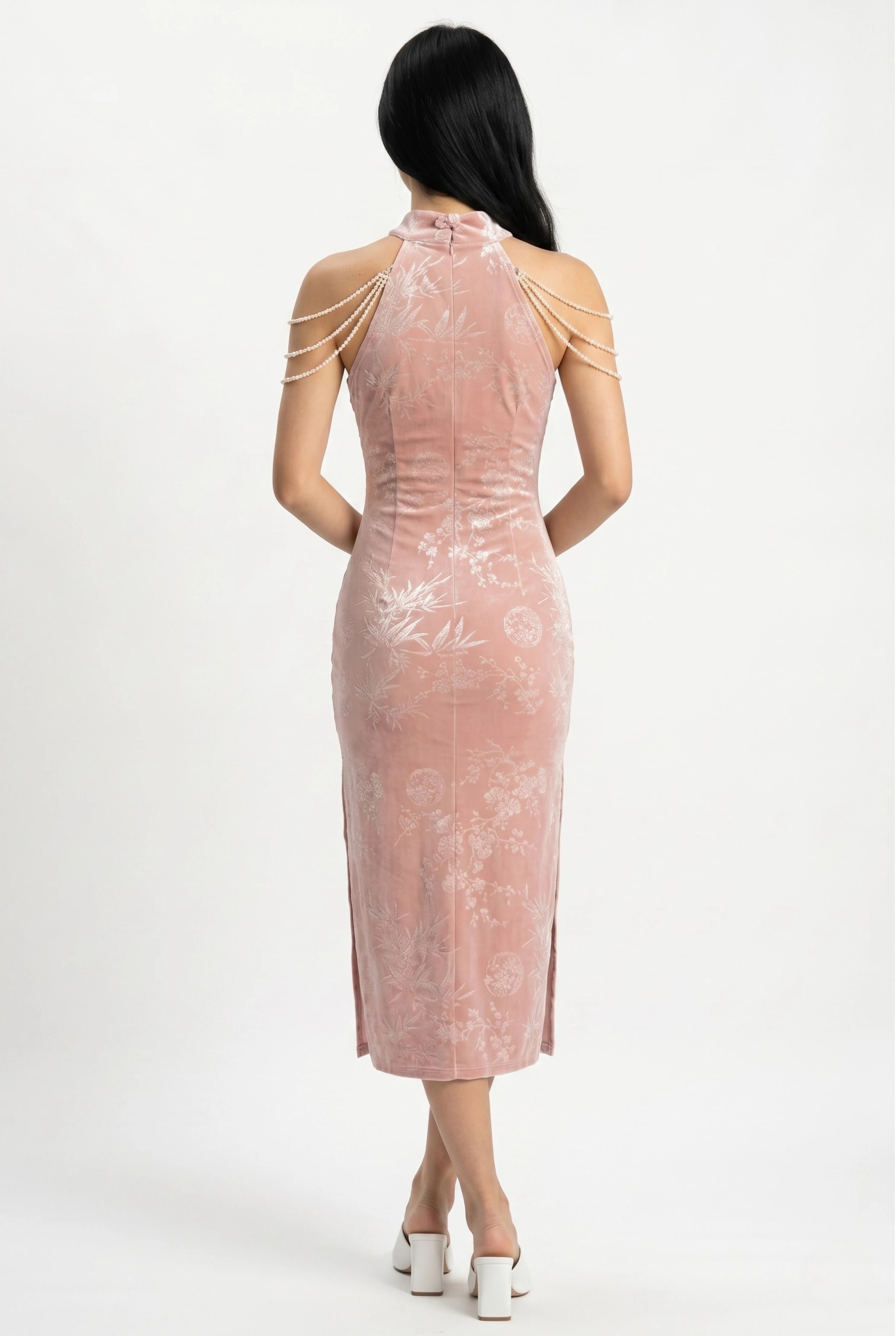 Full-length back view of the pink velvet cheongsam dress showing the tailored midi fit