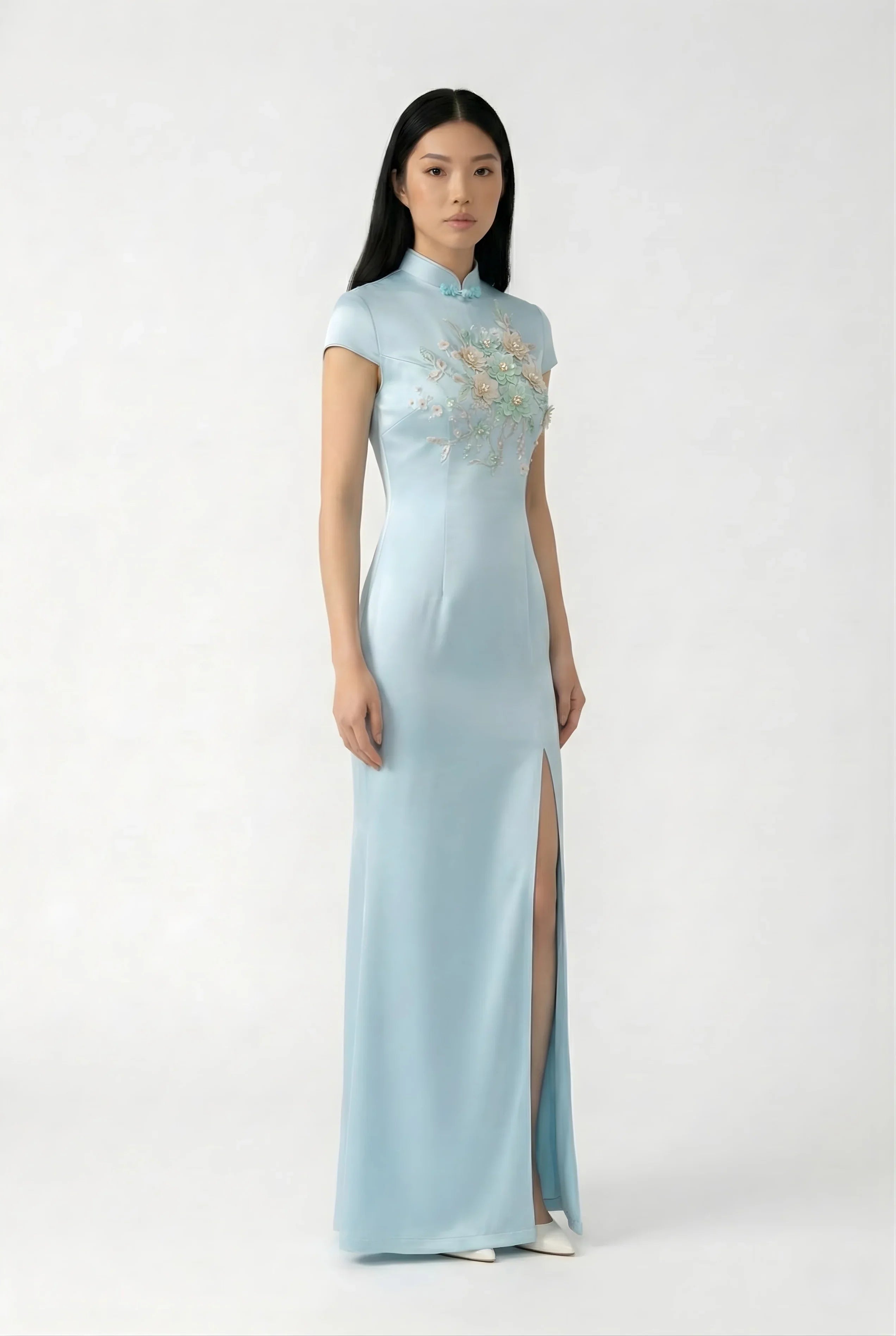 Maison Hua light blue silk qipao with floral embroidery, side profile.