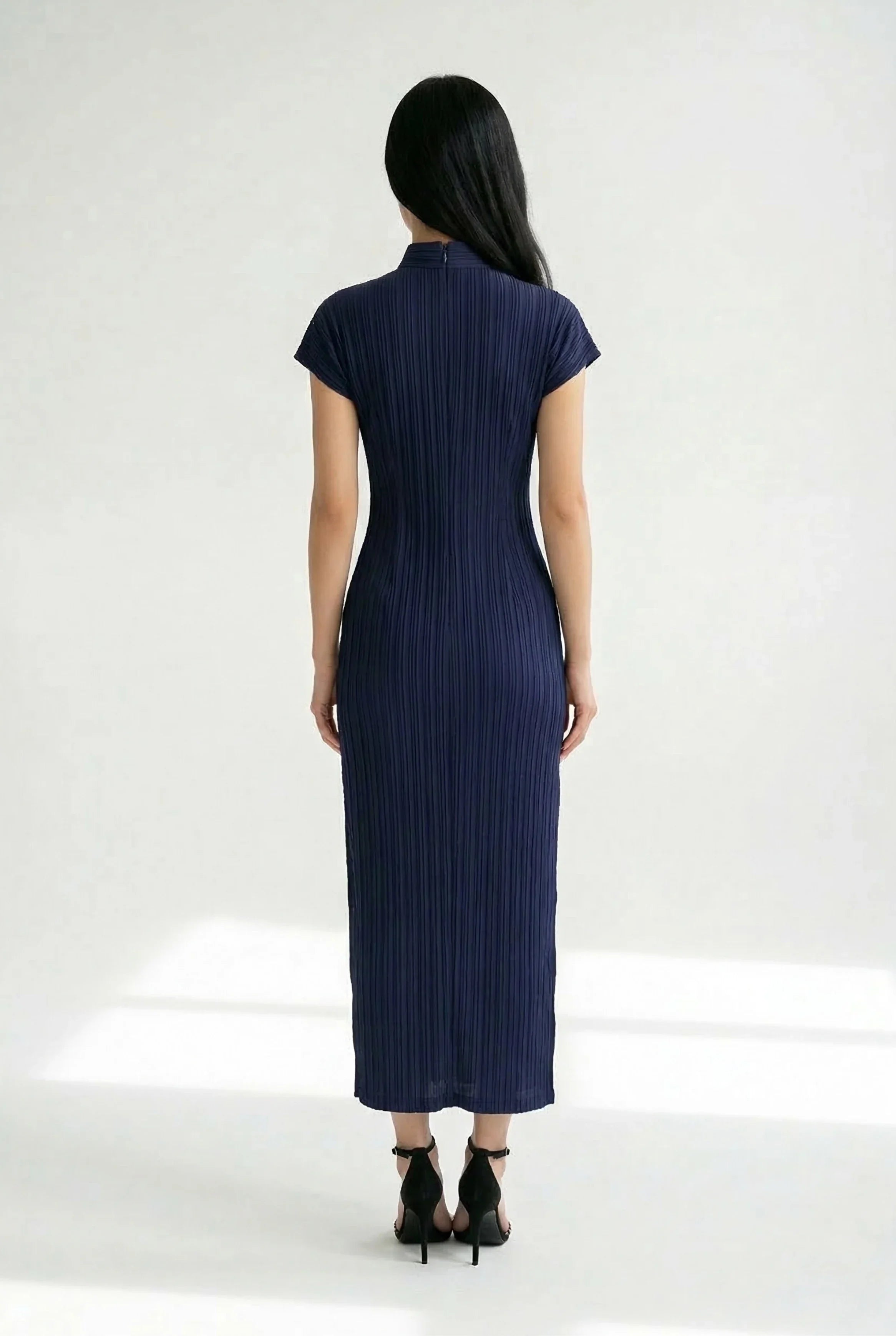 Back view of a long purple Cheongsam dress highlighting the halter-neck design and sleek silhouette.