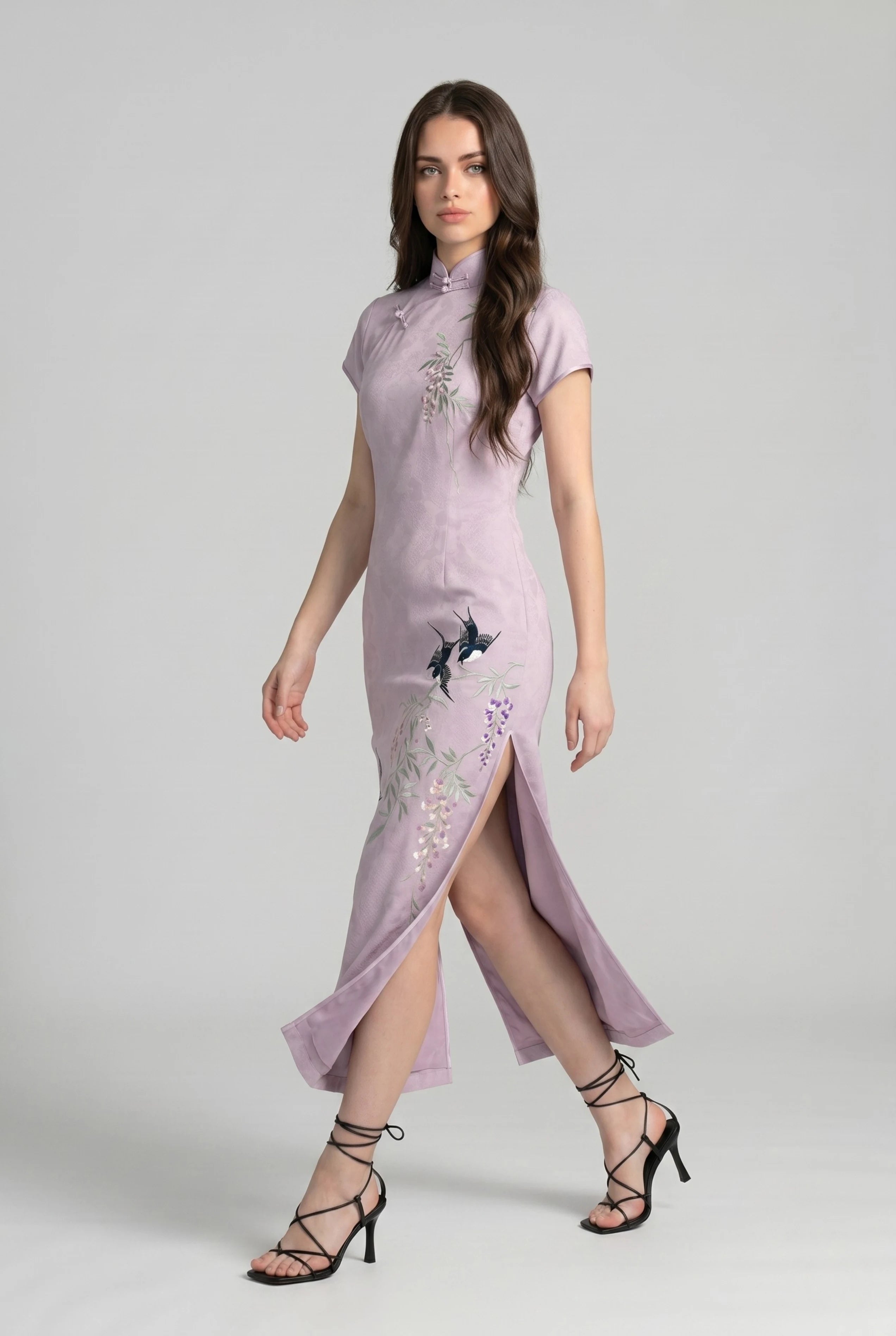 Side profile view of a woman walking in the purple Chinese style dress, showcasing the high side slit and crane embroidery