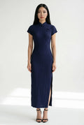 Full-length front view of an elegant purple halter-neck Qipao dress featuring a pearl-embellished collar.