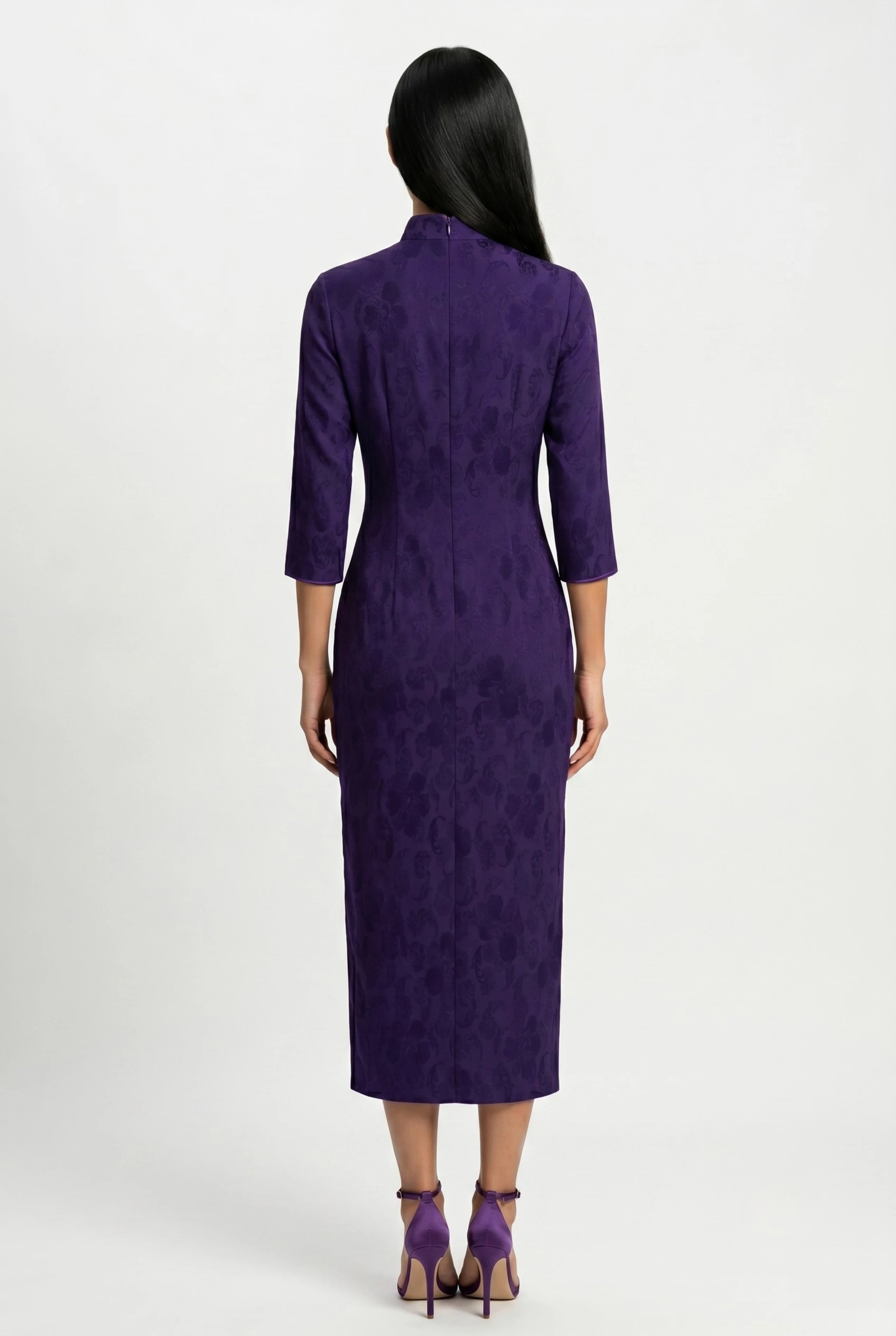Full-length back view of the purple velvet cheongsam dress showing the tailored midi-length fit