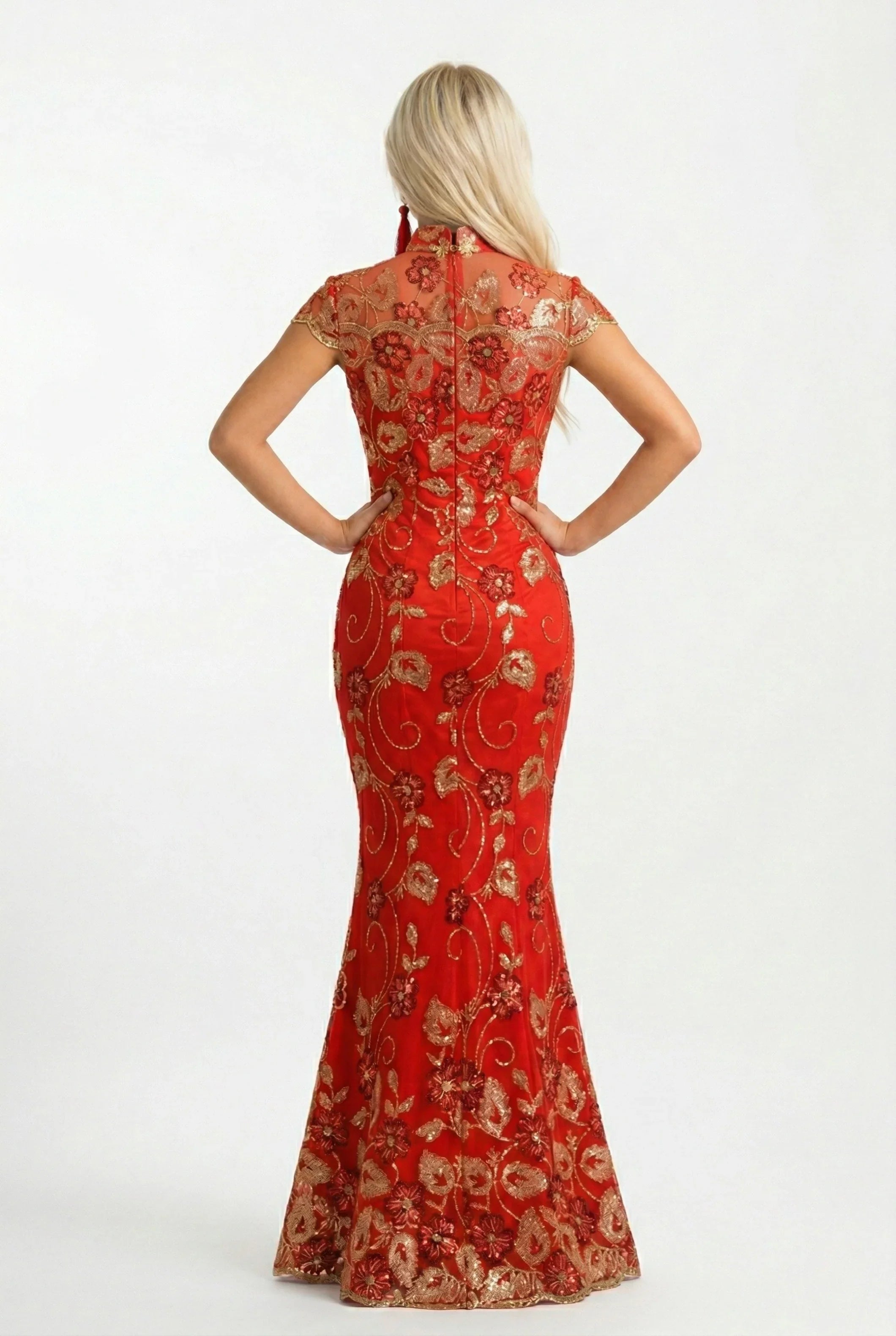 Rear view of a red and gold bridal qipao with mermaid tail.