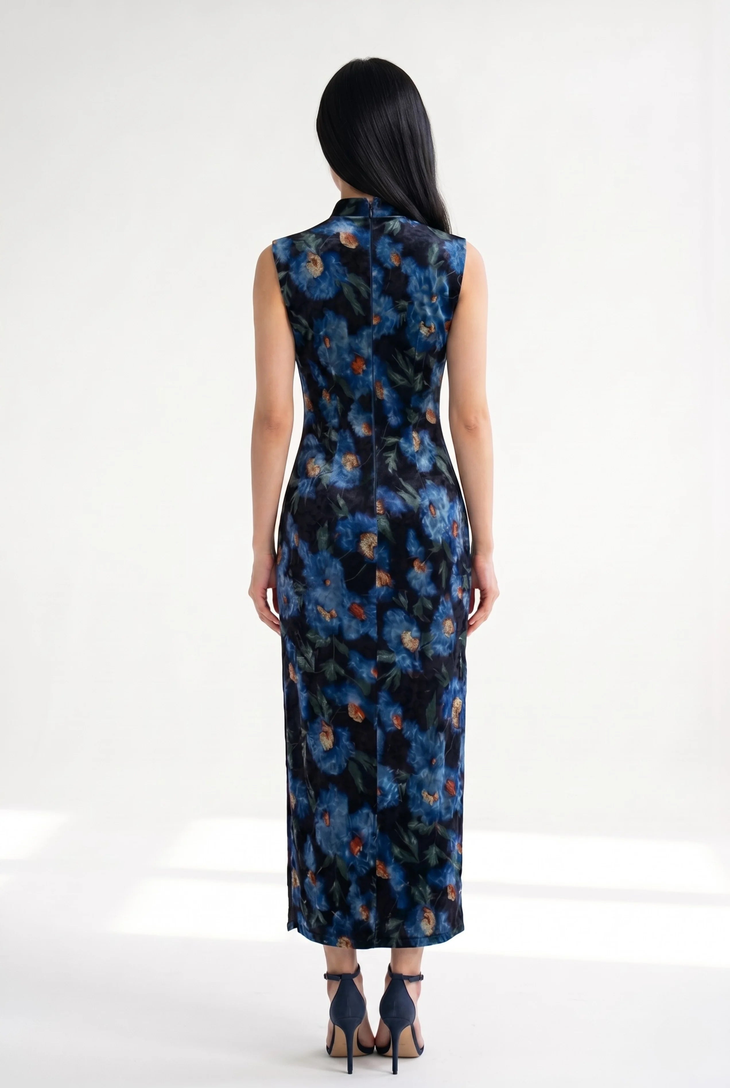 Full-length back view of the sleeveless velvet Chinese dress showing its tailored ankle-length fit