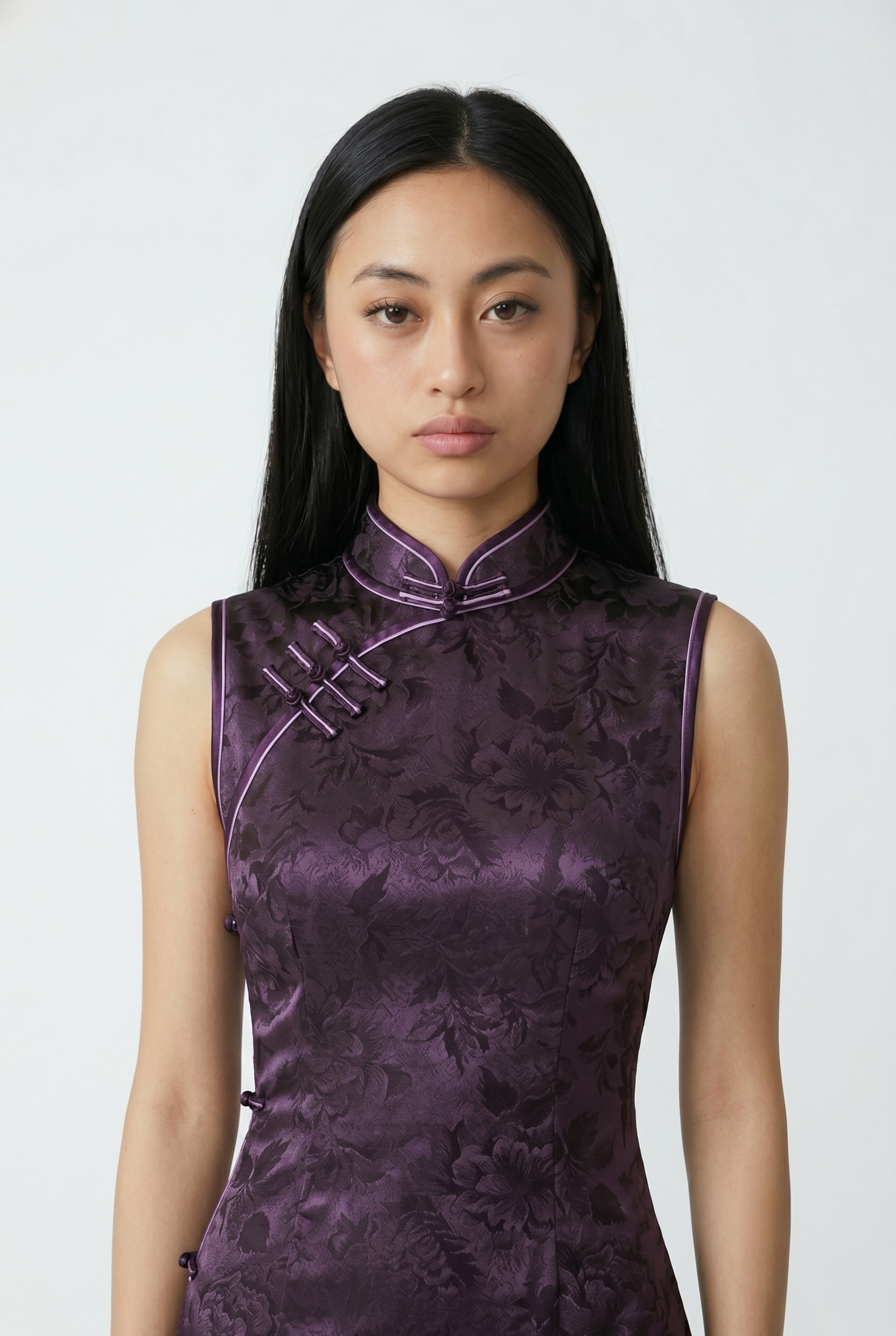 Close-up front view highlighting the high mandarin collar, asymmetrical frog closures, and tonal floral weave on the purple bodice