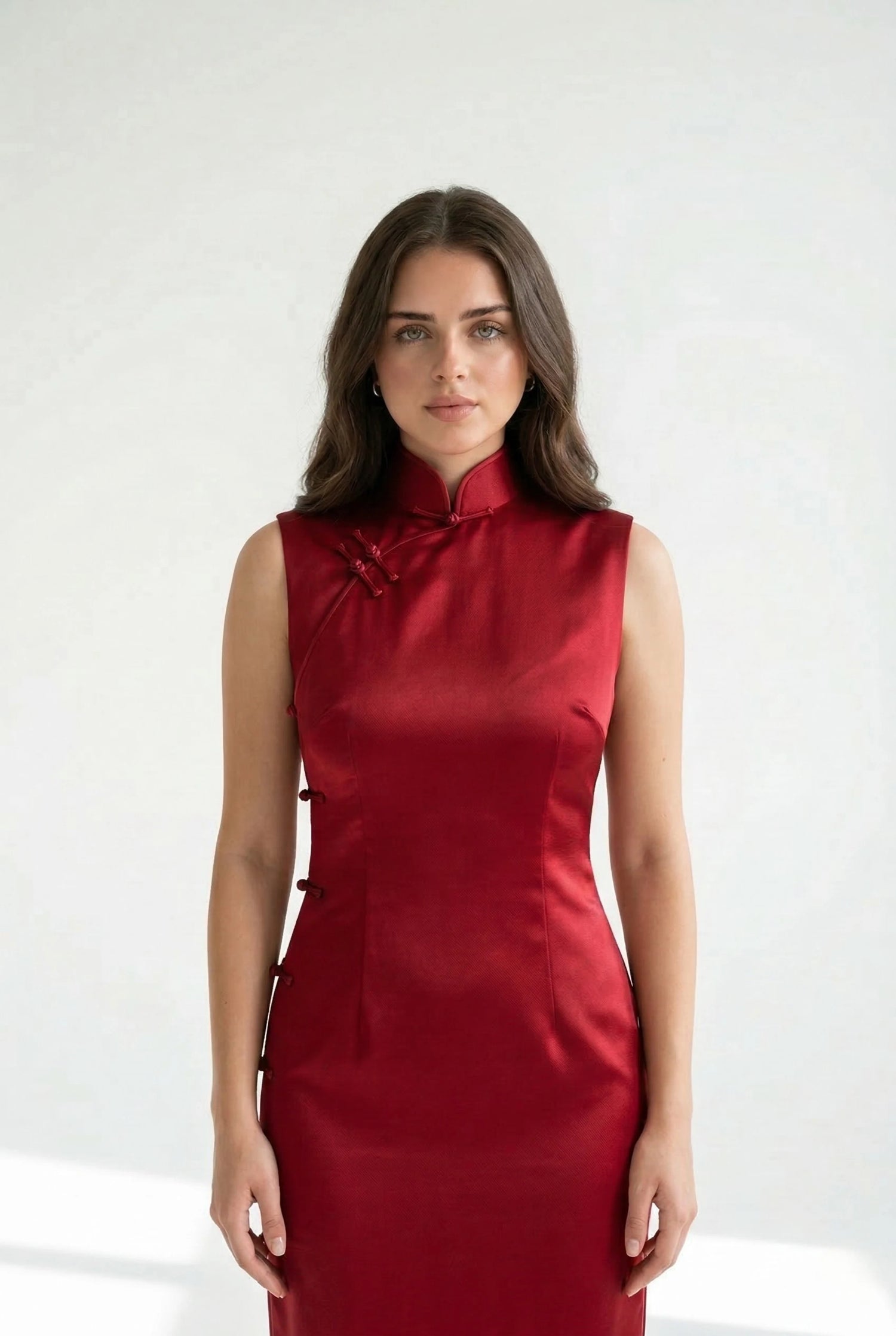 Authentic red qipao dress featuring a signature Mandarin collar and hand-finished Pankou buttons with a focus on structural integrity