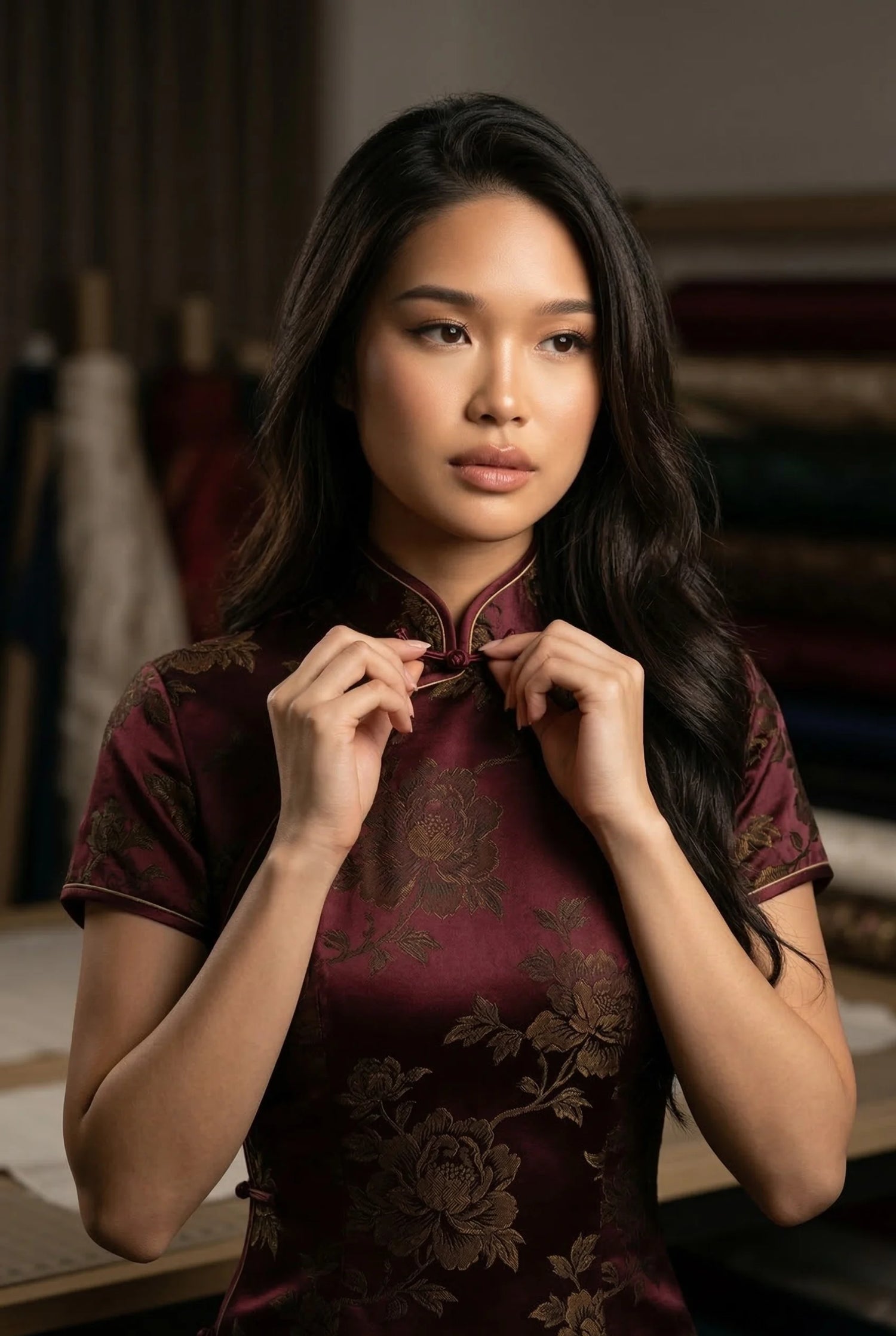 Authentic burgundy silk cheongsam with gold floral patterns, illustrating high standards of traditional Chinese clothing and internal construction