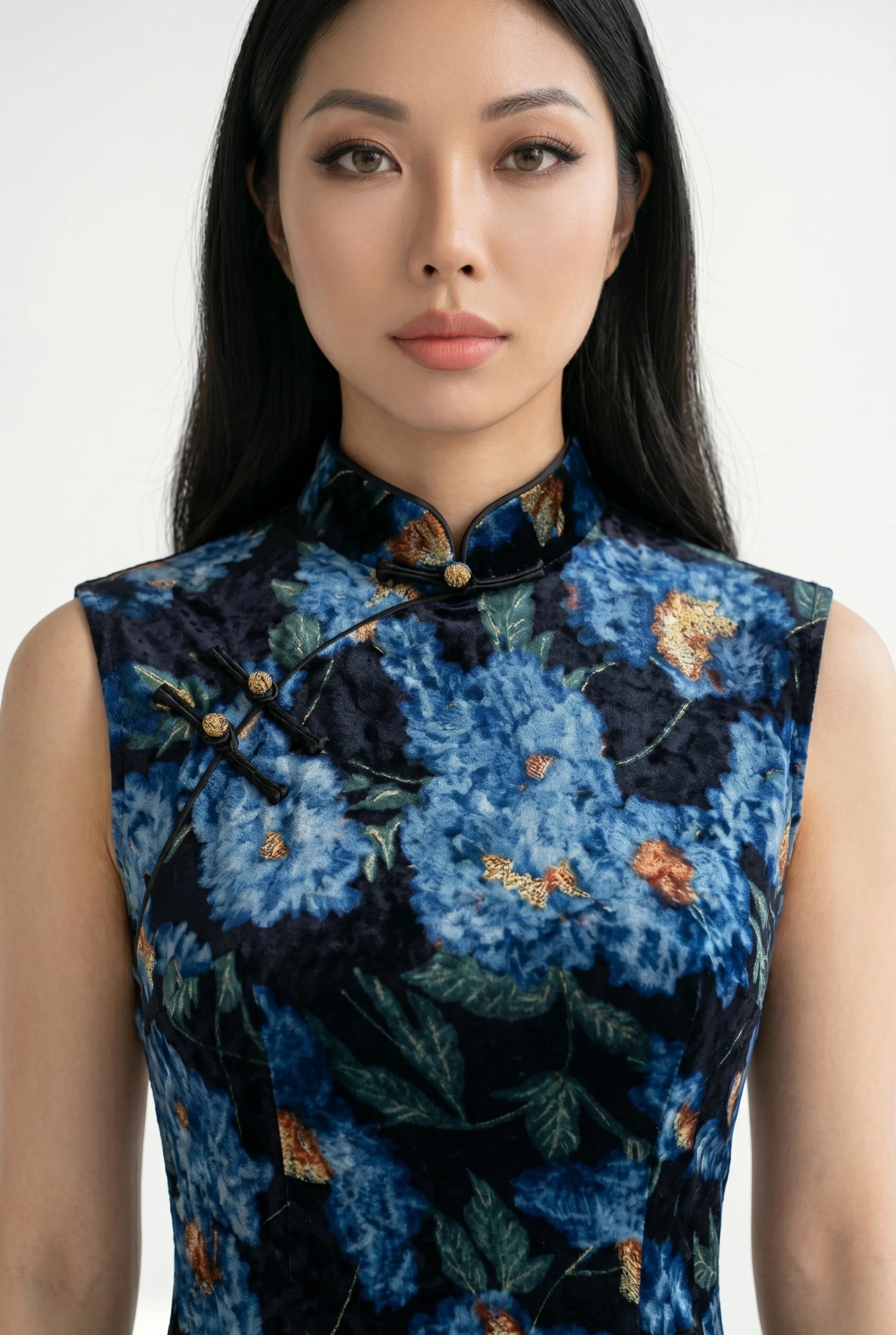 Close-up front view highlighting the high mandarin collar, traditional frog button, and rich blue-orange floral velvet fabric