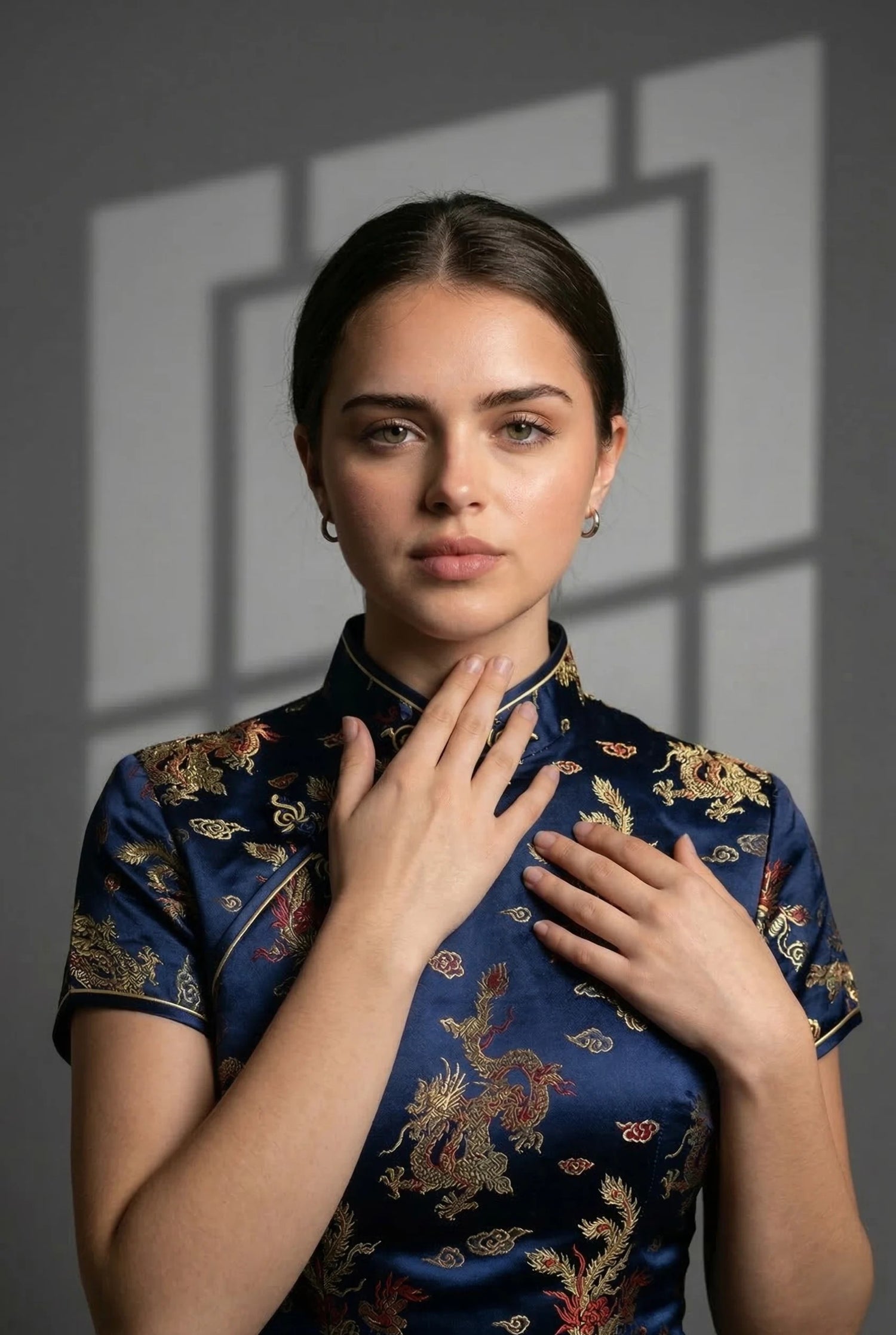 Model demonstrating the Two-Finger Rule for a vintage navy blue silk qipao collar, ensuring a professional fit for non-stretch heritage garments by Maison Hua