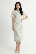 Full-length front view of a white and green watercolor floral Qipao dress featuring sheer chiffon cape sleeves.