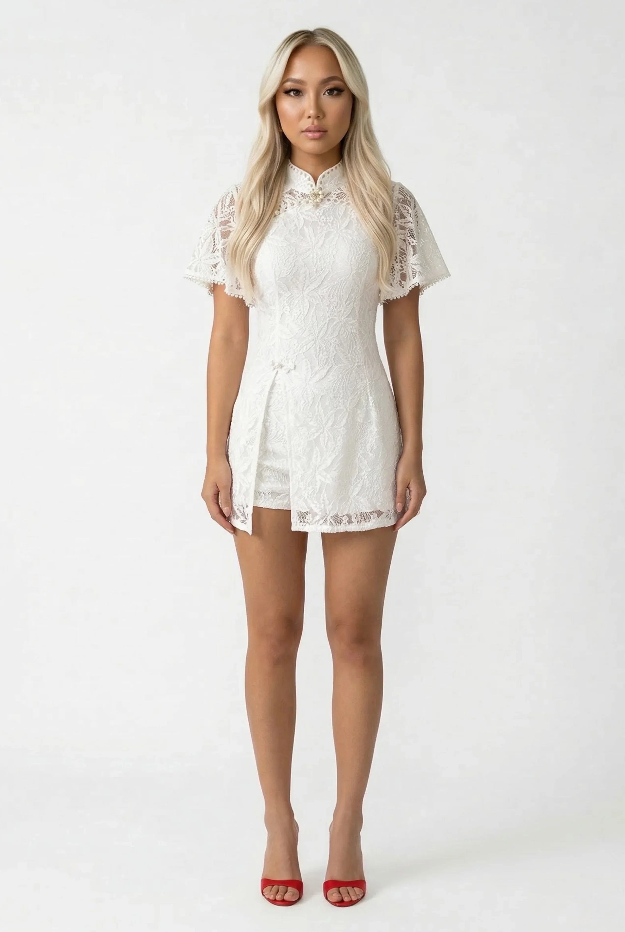 Full-length front view of an elegant white lace Qipao romper featuring a mandarin collar and short sleeves.