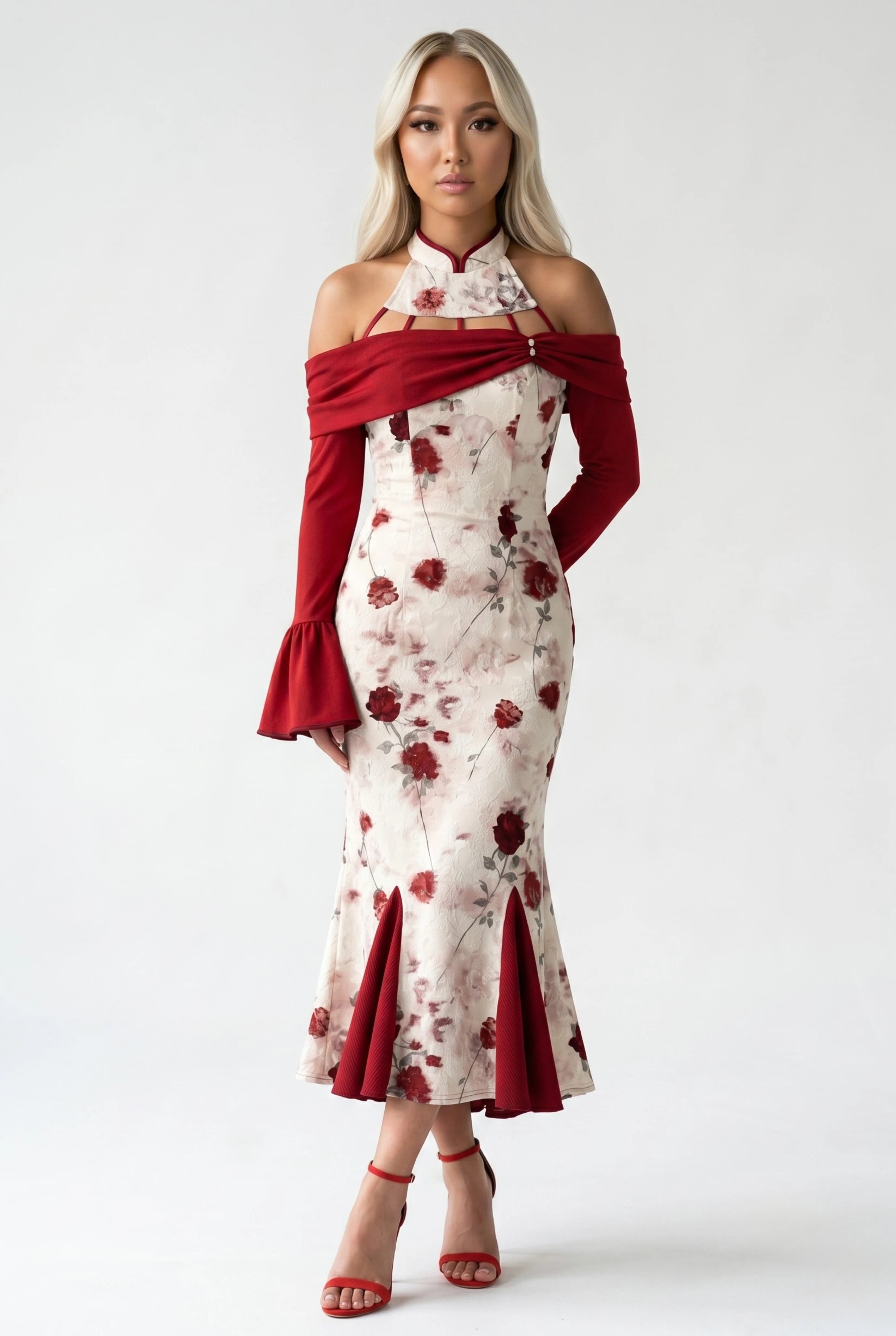 Front full-length view of an off-white and red qipao dress with a cold-shoulder design, flared red sleeves, and red heels