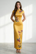 Front view of a long yellow cheongsam dress with colorful floral embroidery.