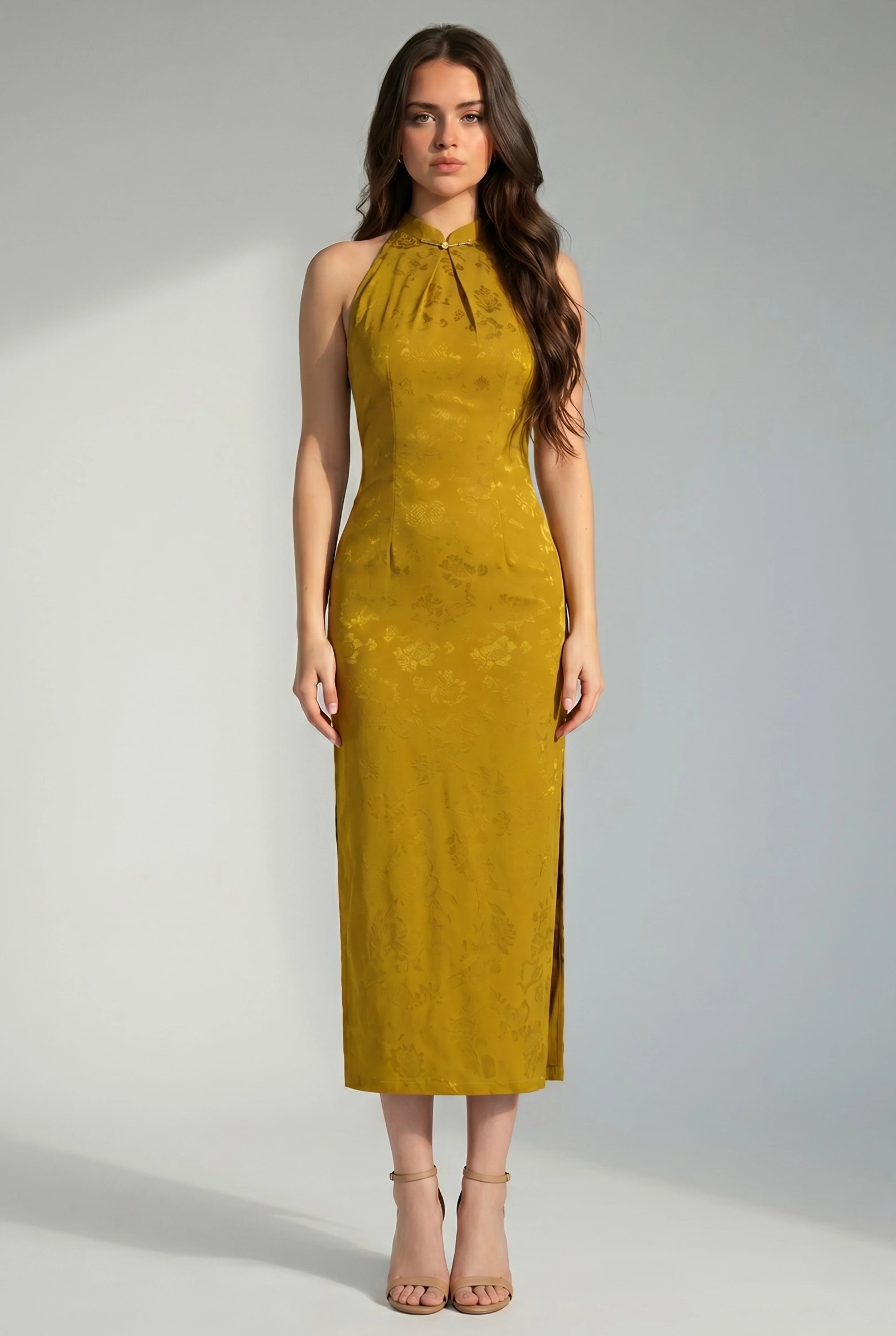 Front full-length view of a halter neck yellow Chinese dress with a slim-fit midi silhouette